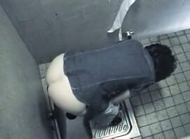 Women's Peeing in a Public Toilet
